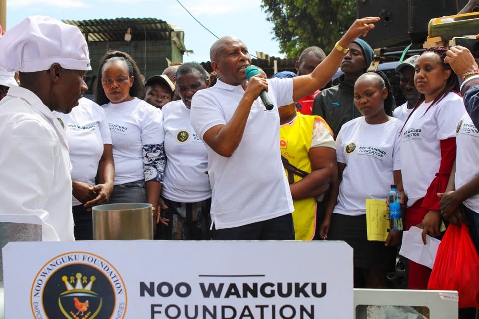 Addressing residents at a Noo Wanguku Foundation community event